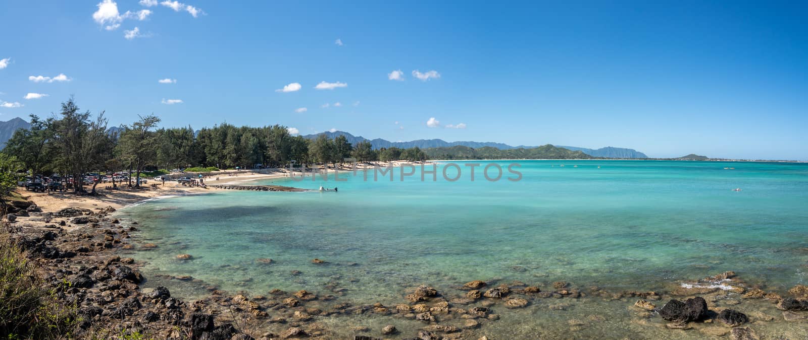 Tourists and locals on Kailua beach on east coast of Oahu by steheap