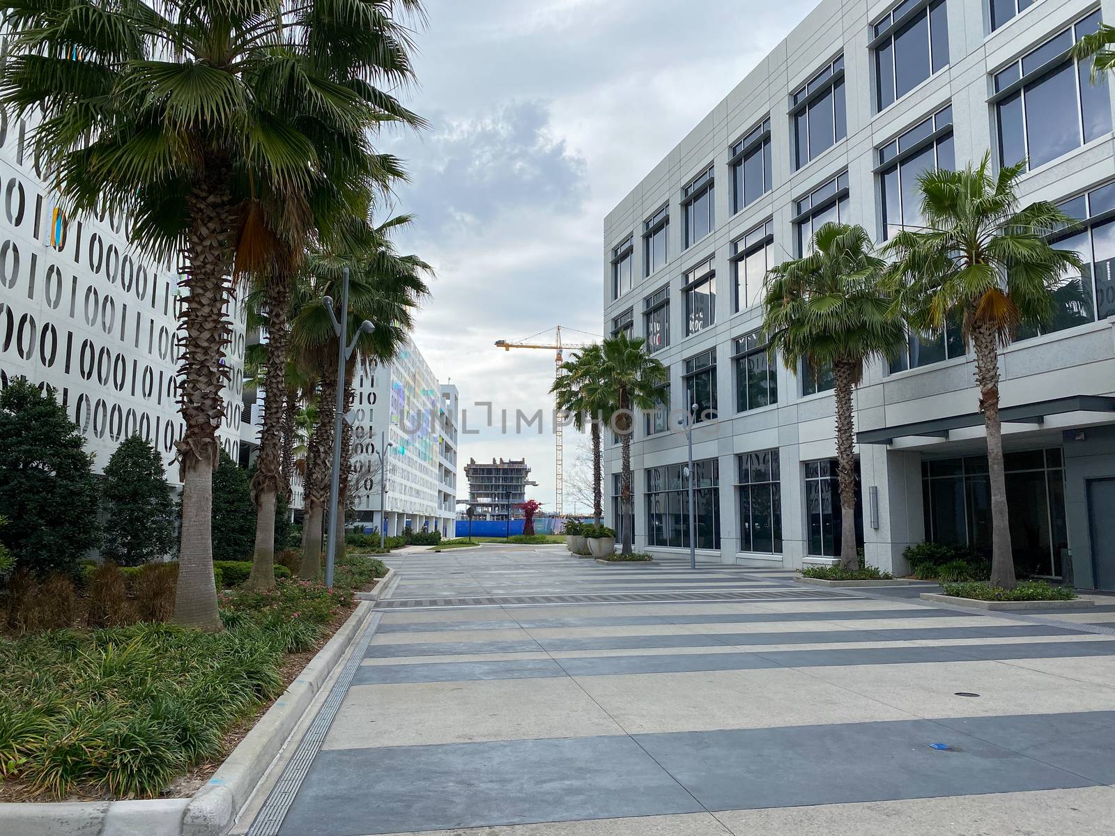 Orlando, FL/USA-4/10/20:  The exterior of the Binary Parking Garage and an office building in Town Center at Laureate Park at Lake Nona in Orlando, Florida.