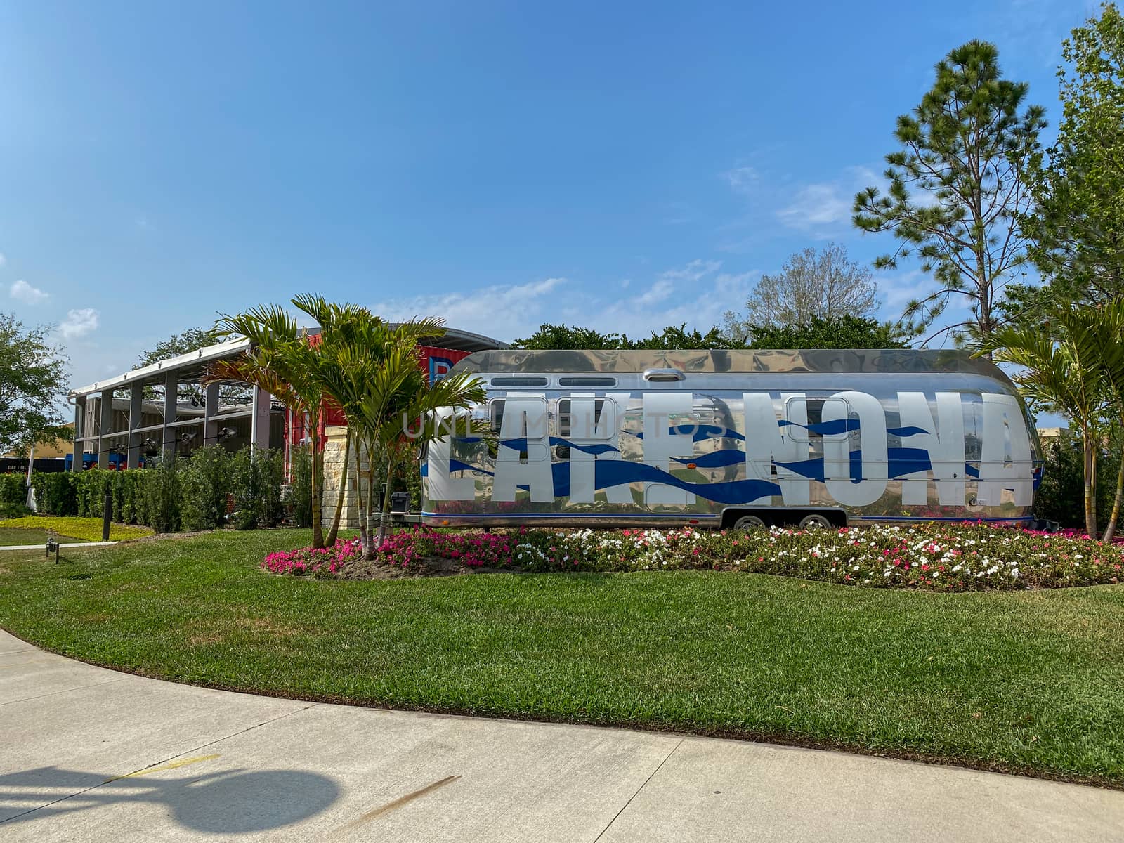 Orlando, FL/USA-4/10/20:  An Airstream Trailer that is painted with the words Lake Nona is the entrance to the Town Center at Lake Nona in Orlando, Florida.