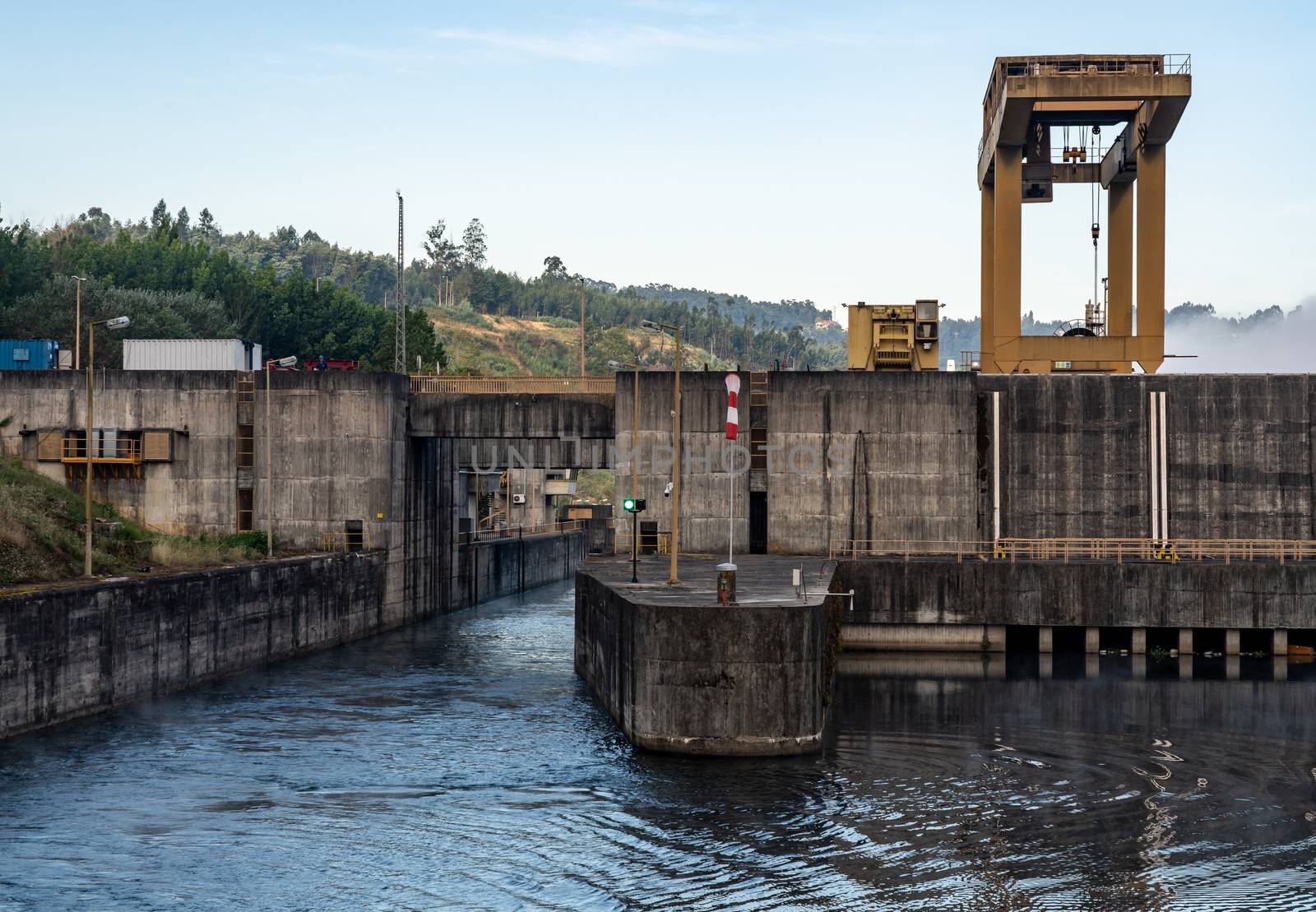 Filled lock as cruise boat leaves the Crestuma Lever dam on River Douro in Portugal