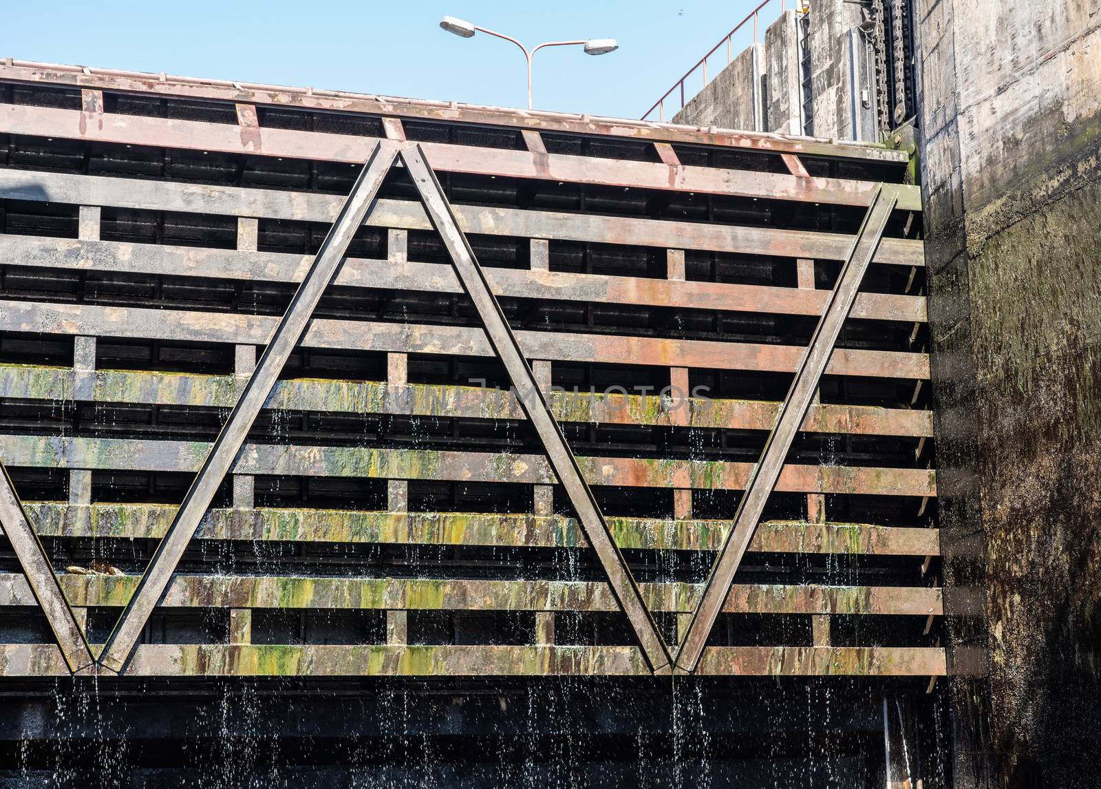Water dripping from the lock gates of the Carrapatelo dam on River Douro as the level in the dock goes down