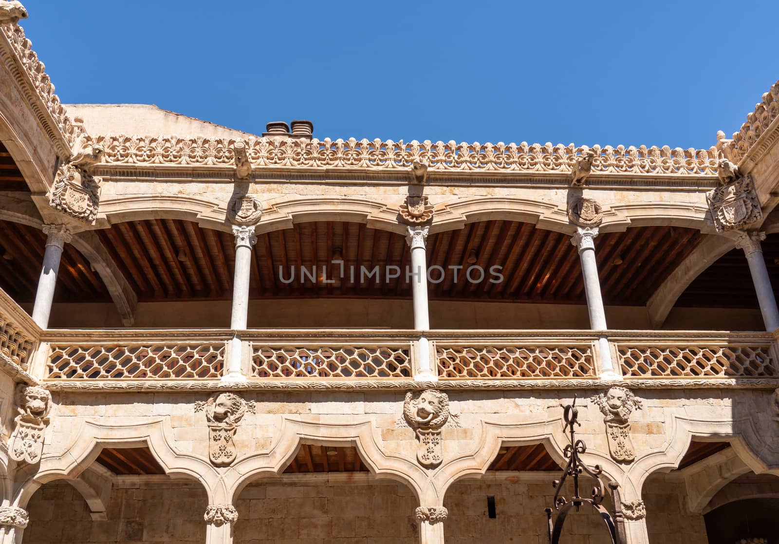 Ornate stone carvings on the Casa de la Conchas or shells around the central courtyard in Salamanca