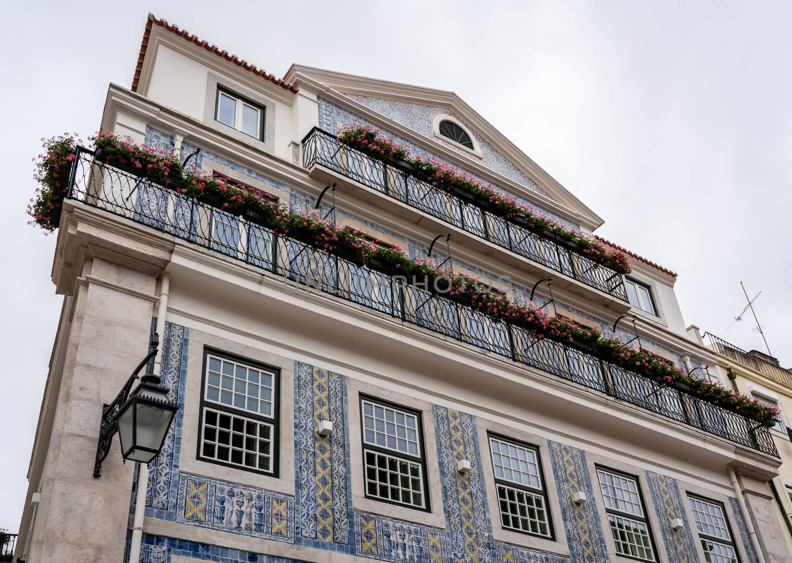 Decorative ceramic tiles on a large house with balconies in downtown Lisbon, Portugal