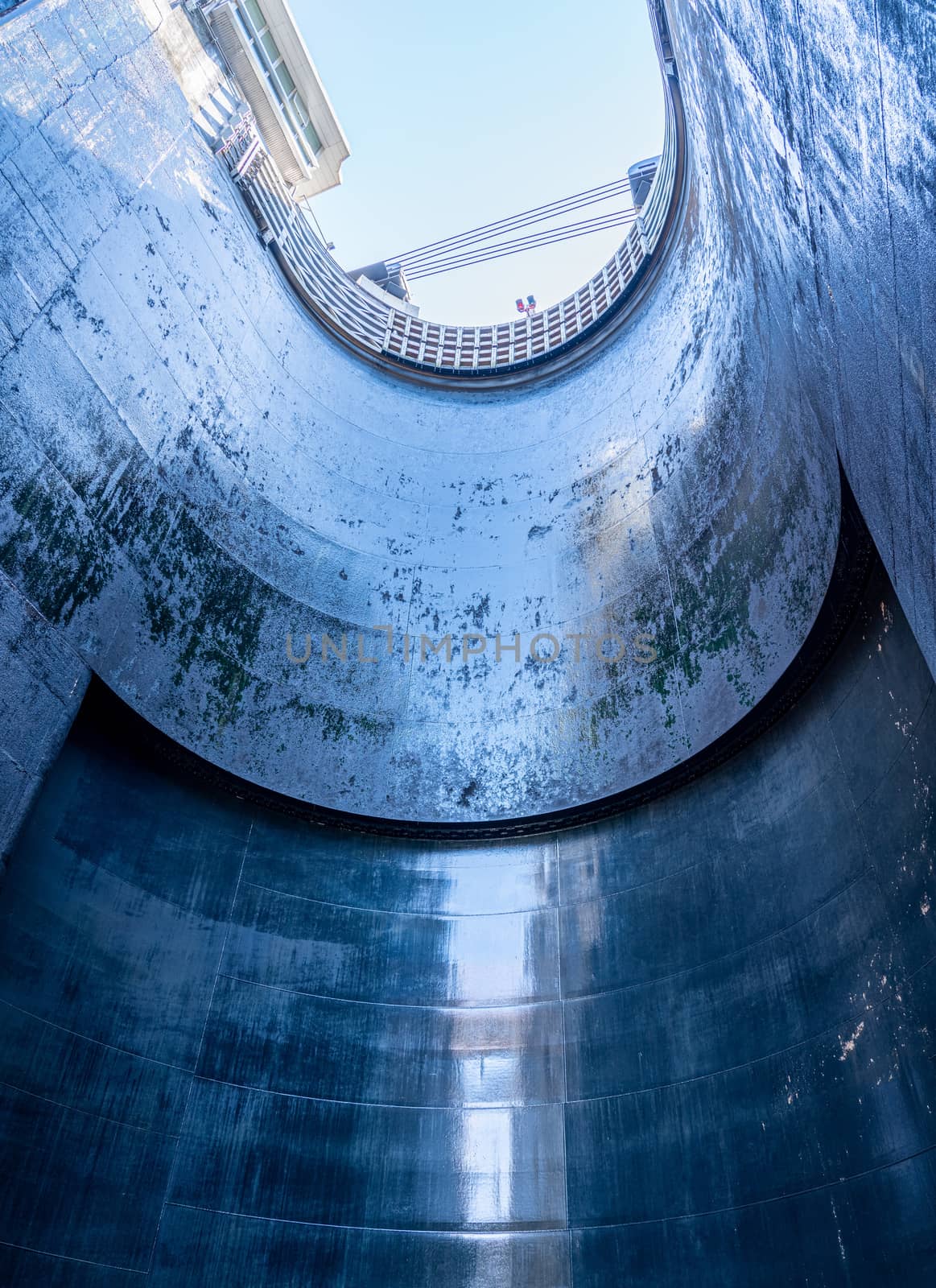 View upwards inside the very deep lock of the Barrapatelo dam on River Douro in Portugal by steheap