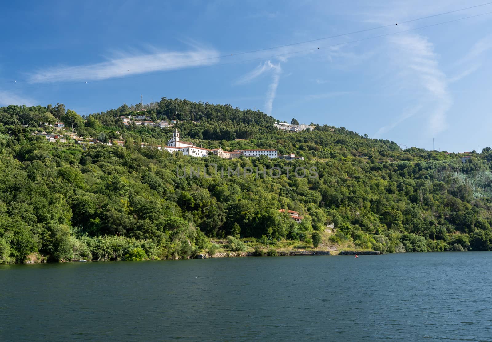 Whitewashed old Alpendurada convent on the banks of the River Douro in Portugal