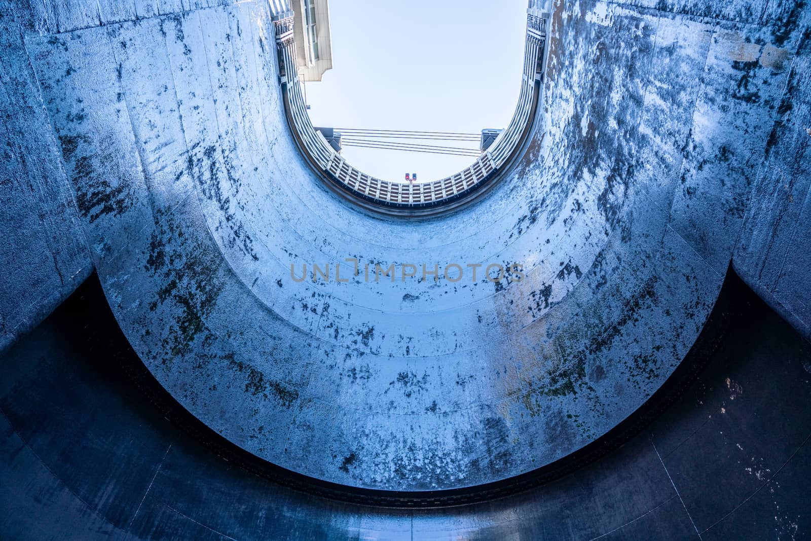 View towards the sky inside the very deep lock of the Barragem do Carrapatelo on Douro River in Portugal