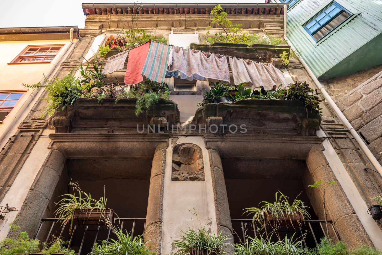 Porto, Portugal - 12 August 2019: Balconies of apartments and homes in downtown Porto