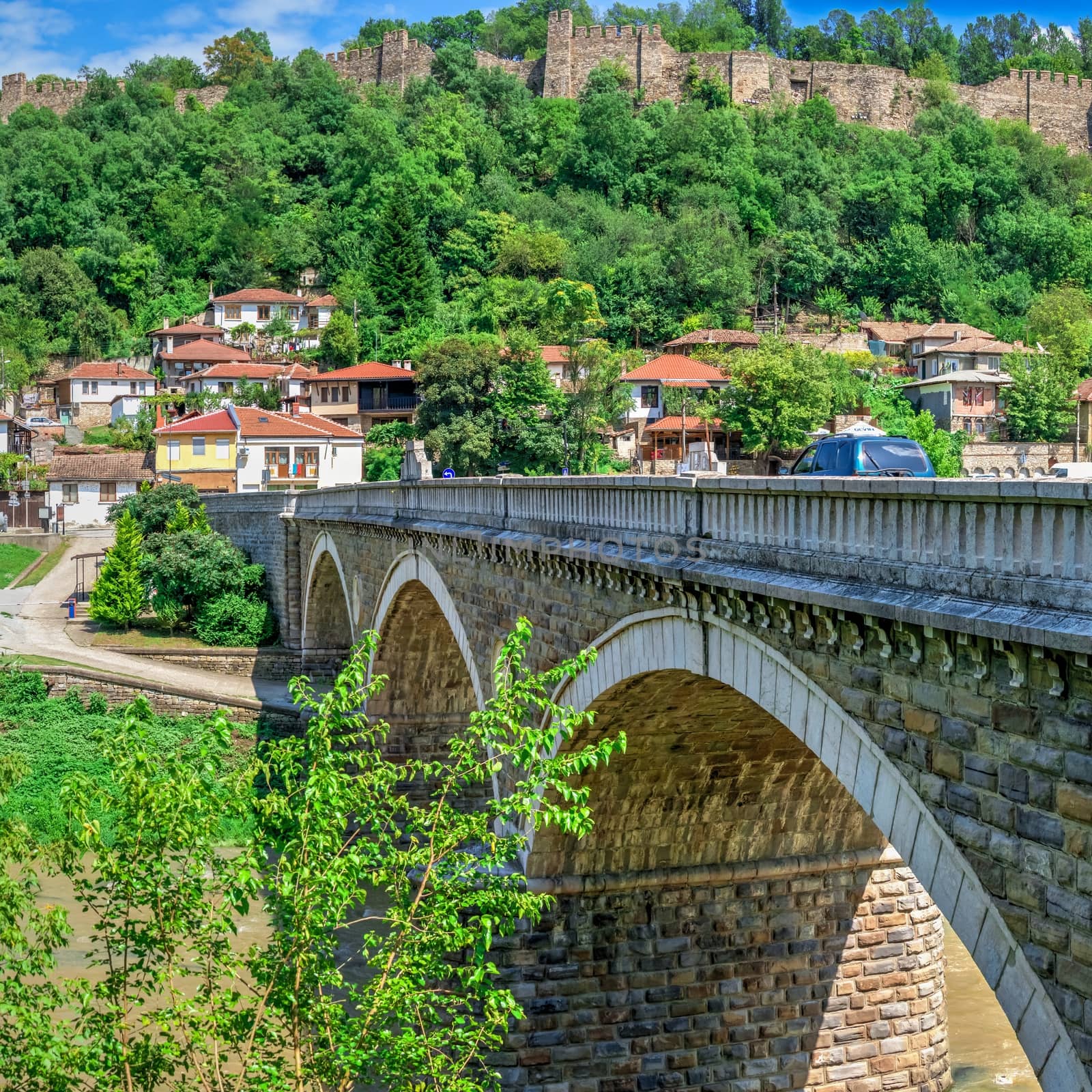 Bridge over the Yantra River near Veliko Tarnovo Fortress, Bulgaria. Hi res panoramic view on a sunny summer day.