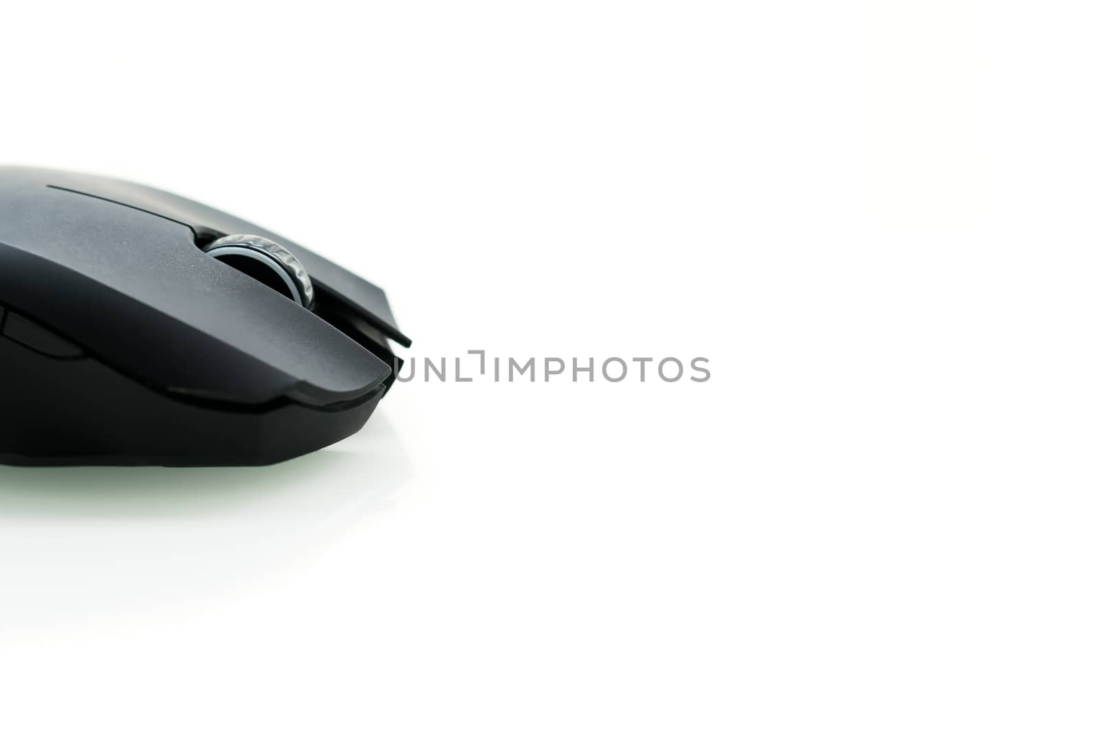Wireless black computer mouse isolated on white background, closeup sideview