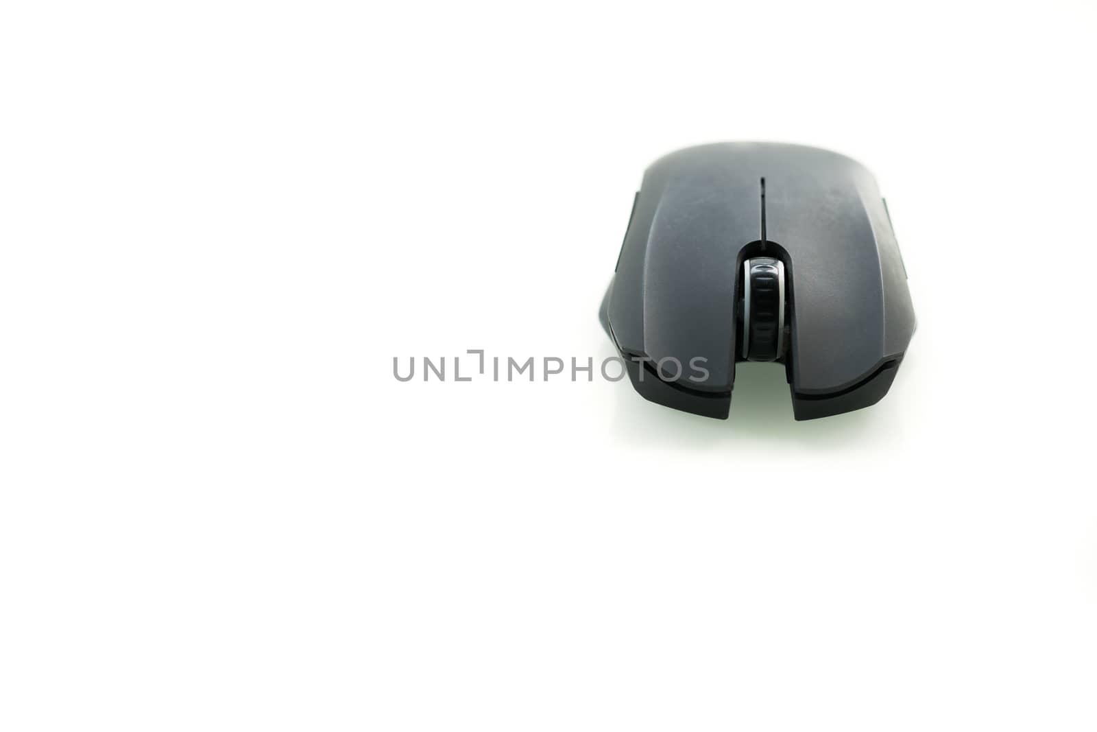 Wireless black computer mouse isolated on white background, frontview