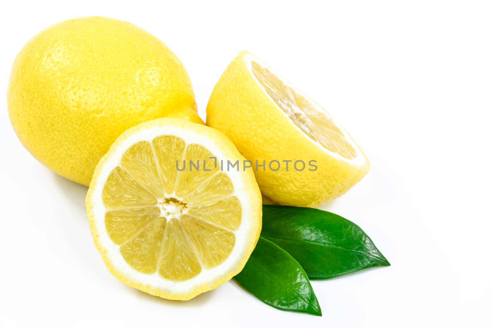 Two fresh lemons with green leaves isolated on white background