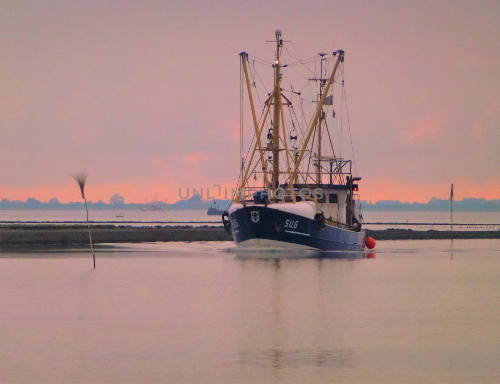 Ship returning from the north sea near Husum, Germany