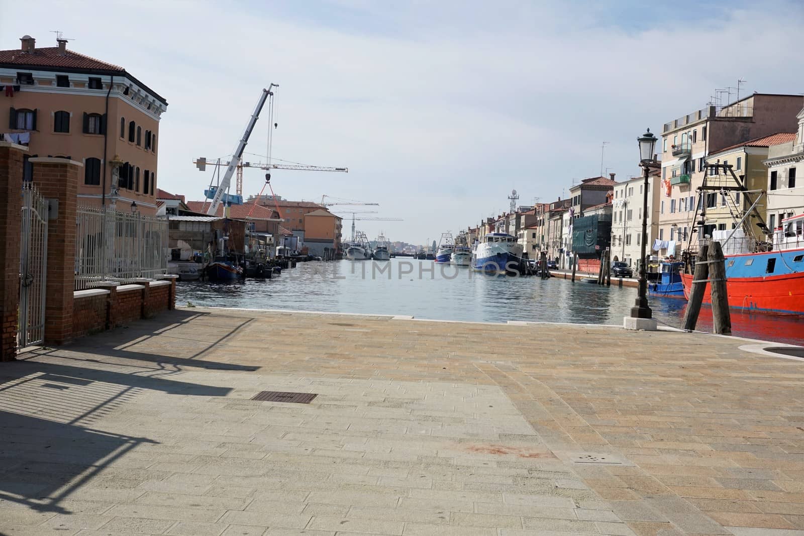 The port of Chioggia with cranes and fisherboats by pisces2386