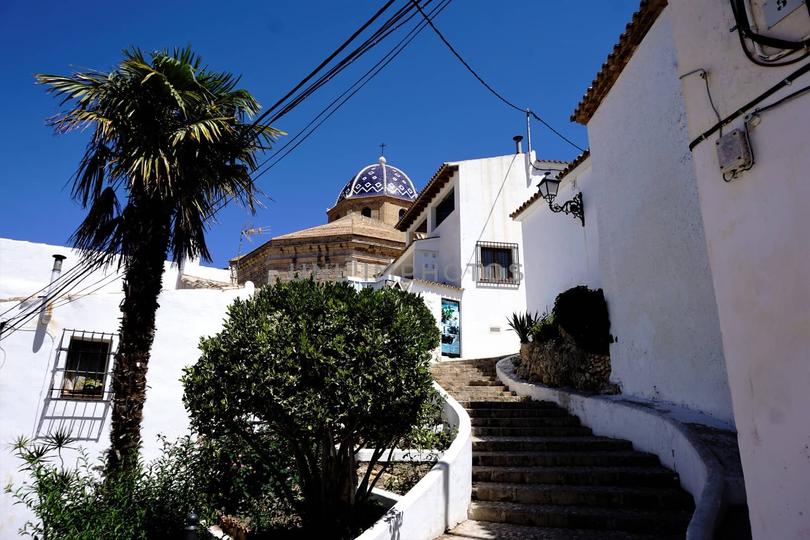 Typical white houses, steps and church in Altea by pisces2386