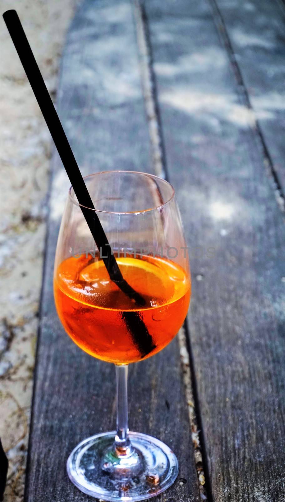 Aperol Sprizz on wooden table by pisces2386