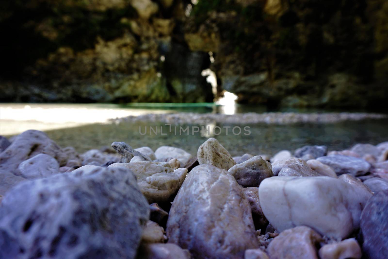 Pebble stones in front of a gorge in Kranjska Gora, Slovenia