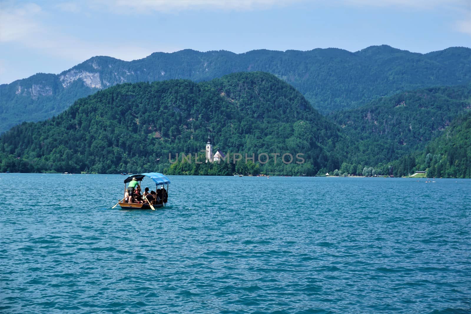 Traditional Pletna boat on it's way to Bled Island, Slovenia