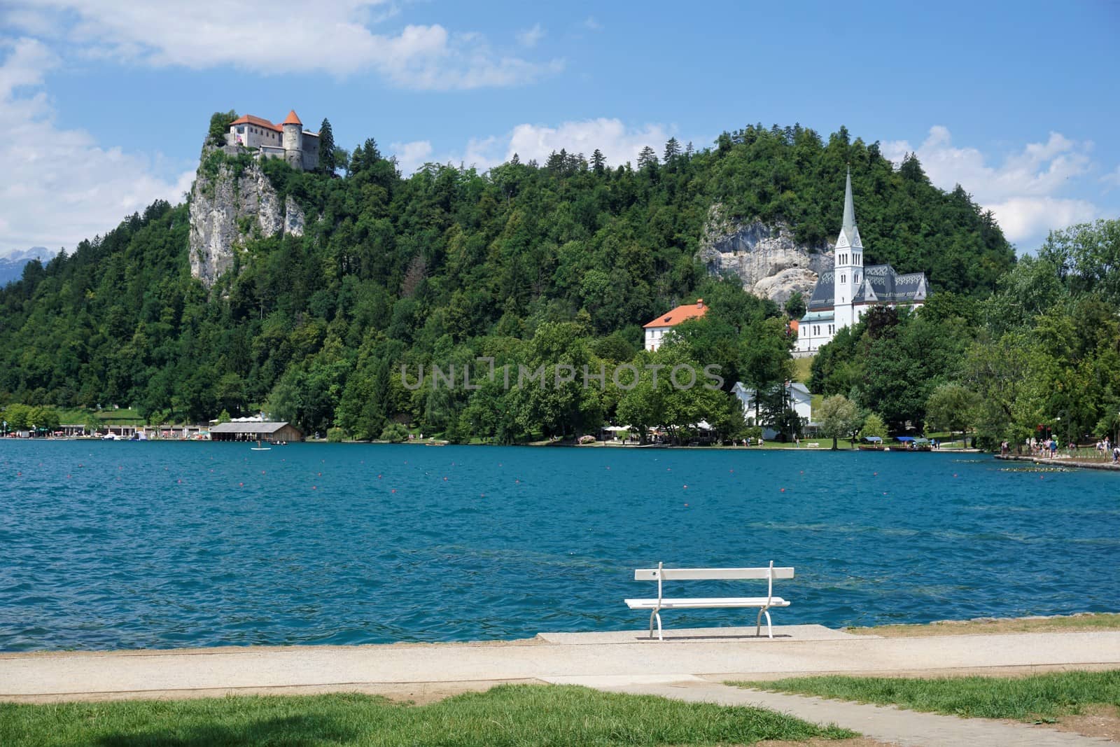 Lake Bled with castle and white bench by pisces2386