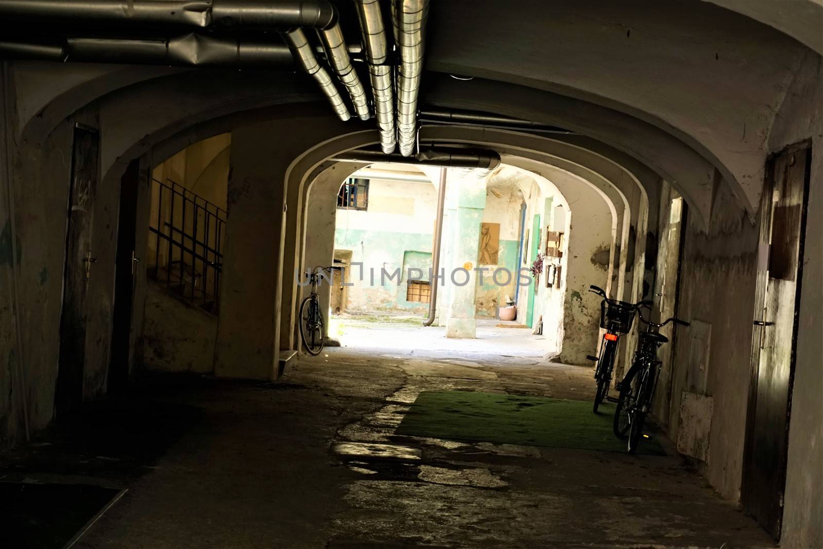 Dark passage with bicycles in Ljubljana, Slovenia