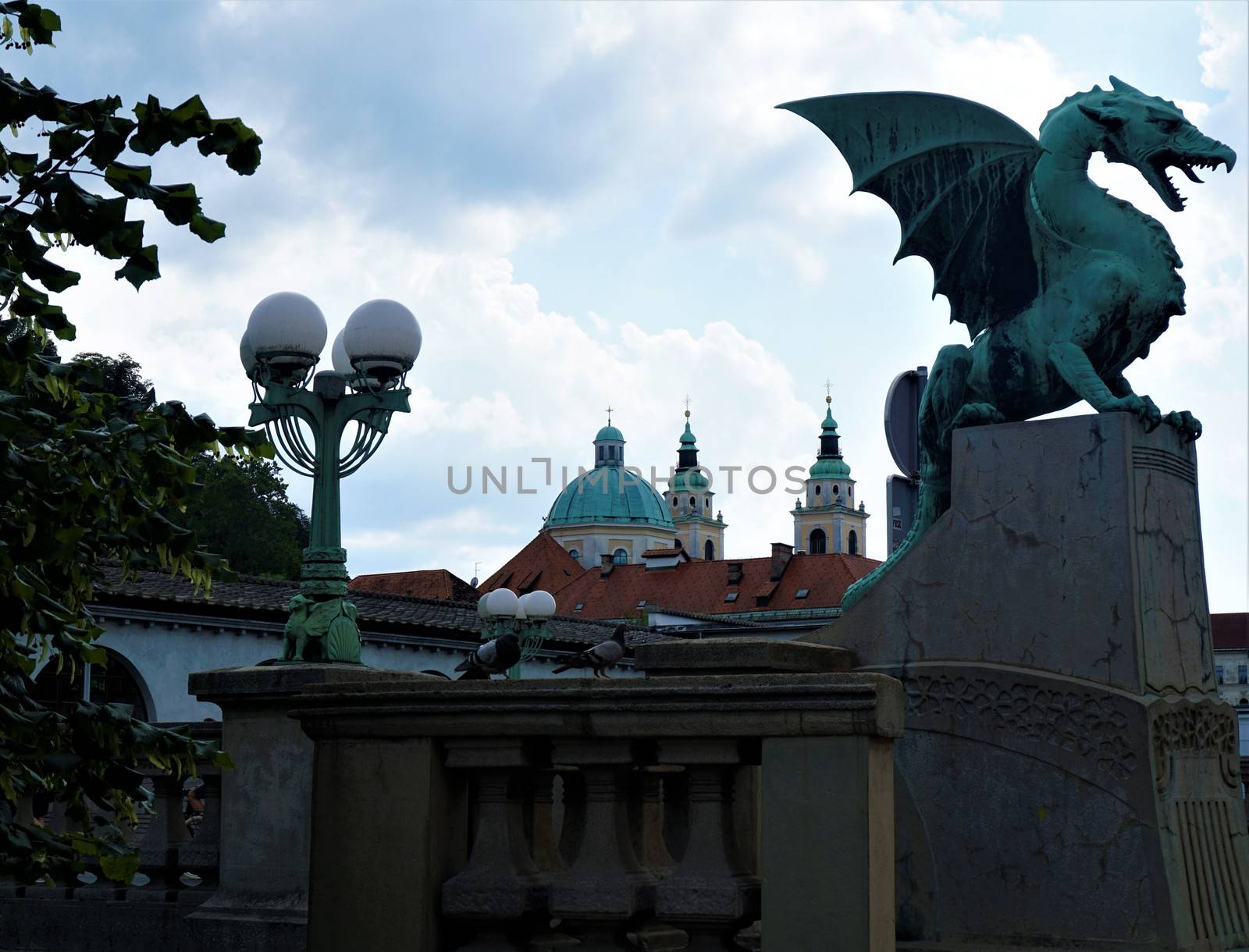 Dragon bridge and St. Nicholas cathedaral Ljubljana by pisces2386