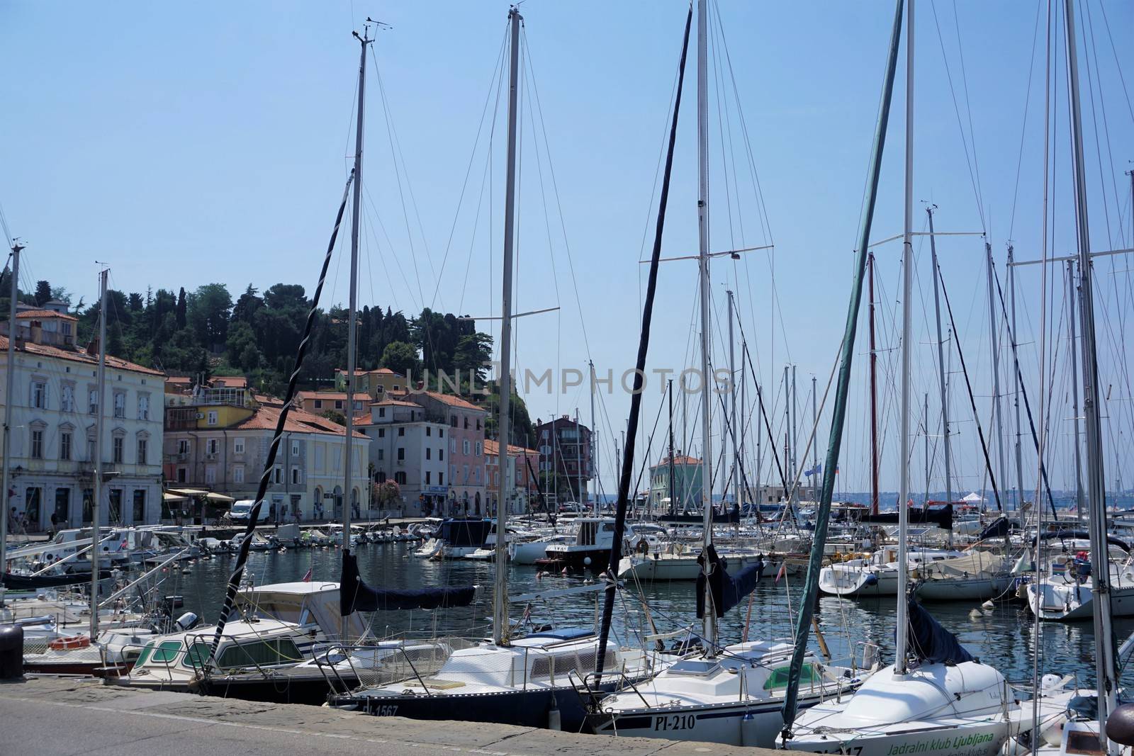 Boats and houses at the port of Piran by pisces2386