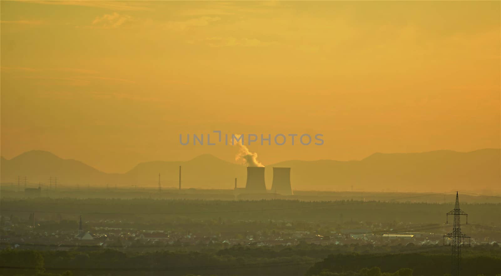 View over rhine valley with nuclear power plant and mountains in the distance