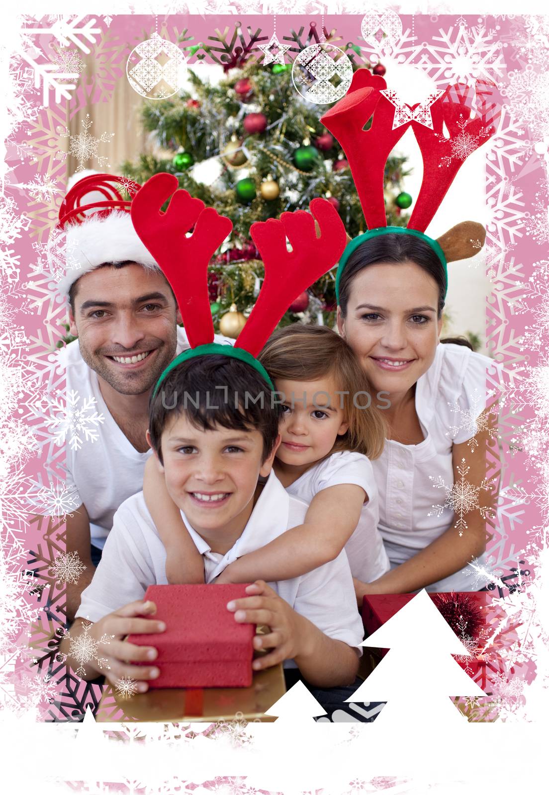 Lovely family giving presents for Christmas against christmas themed frame