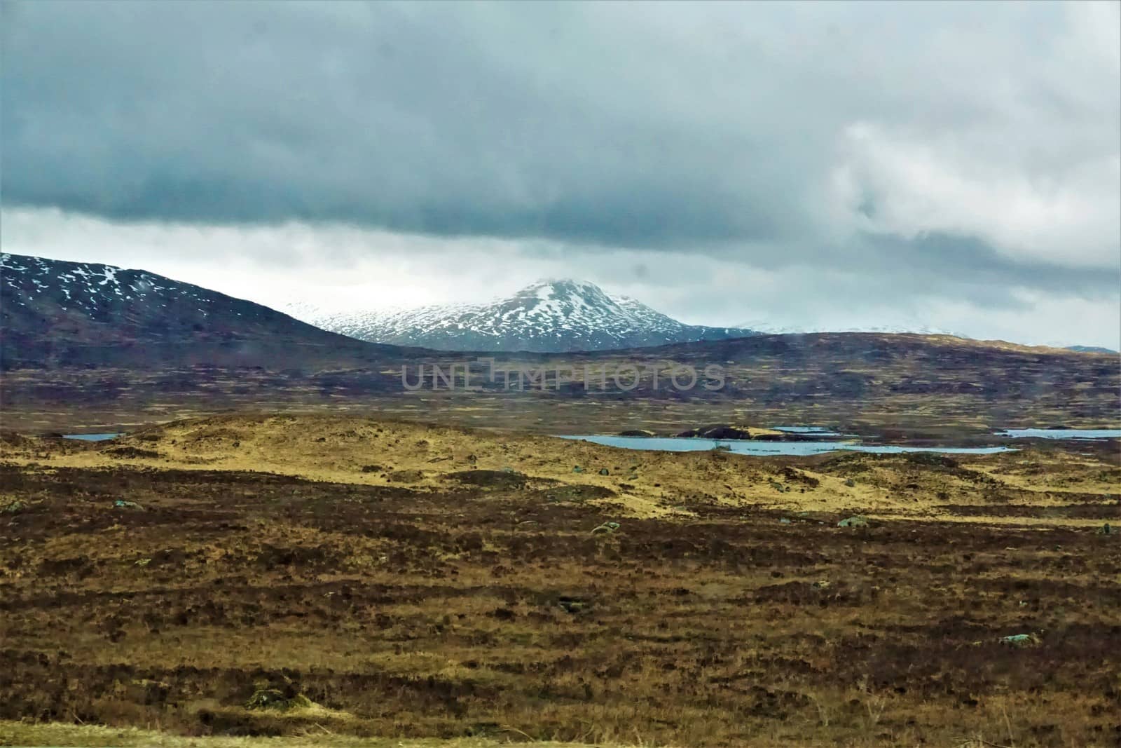 Glen coe mountain range behind Lochan na h-Achlaise, Bridge of Orchy by pisces2386