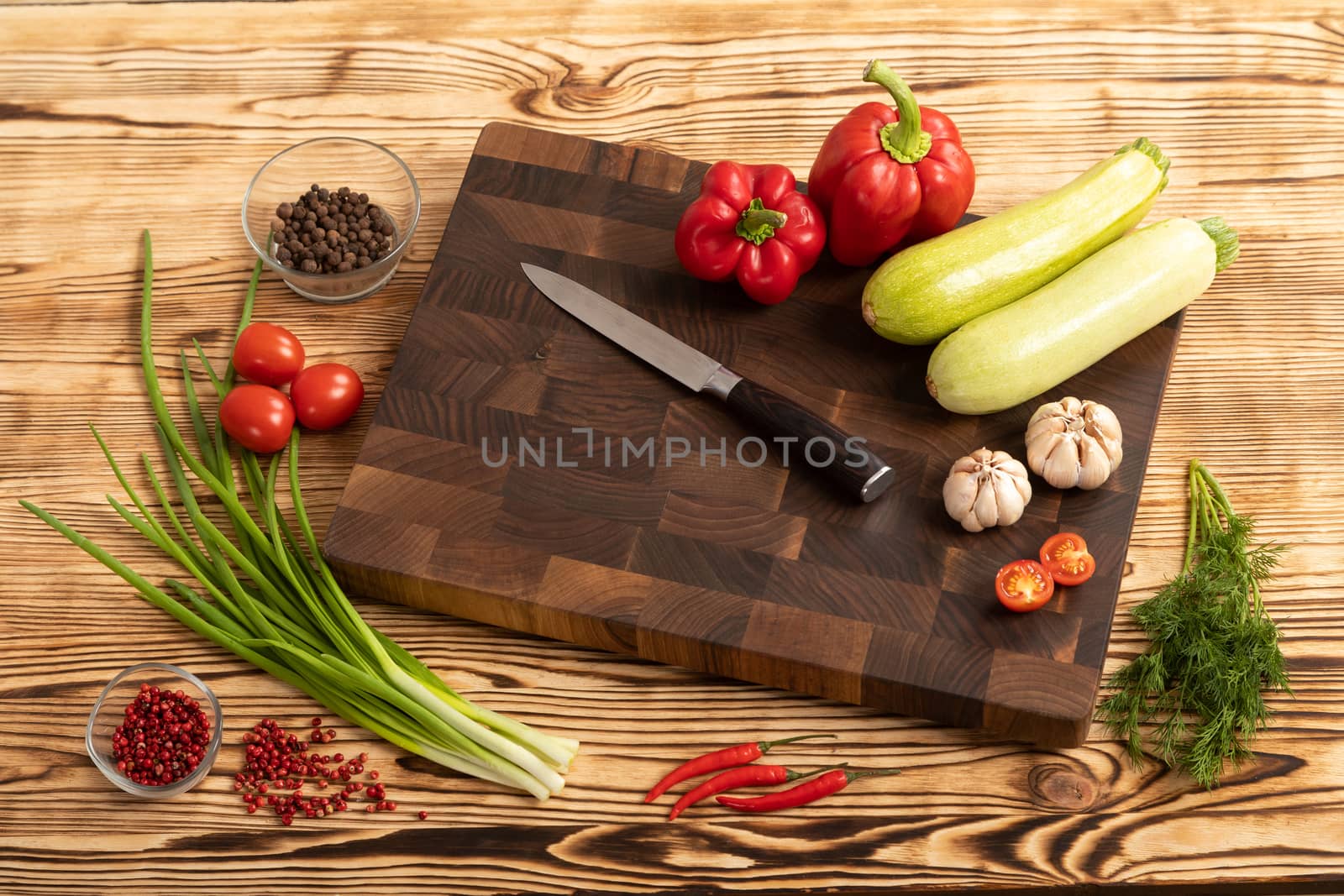 vegetables and greens on wooden cutting board by sveter