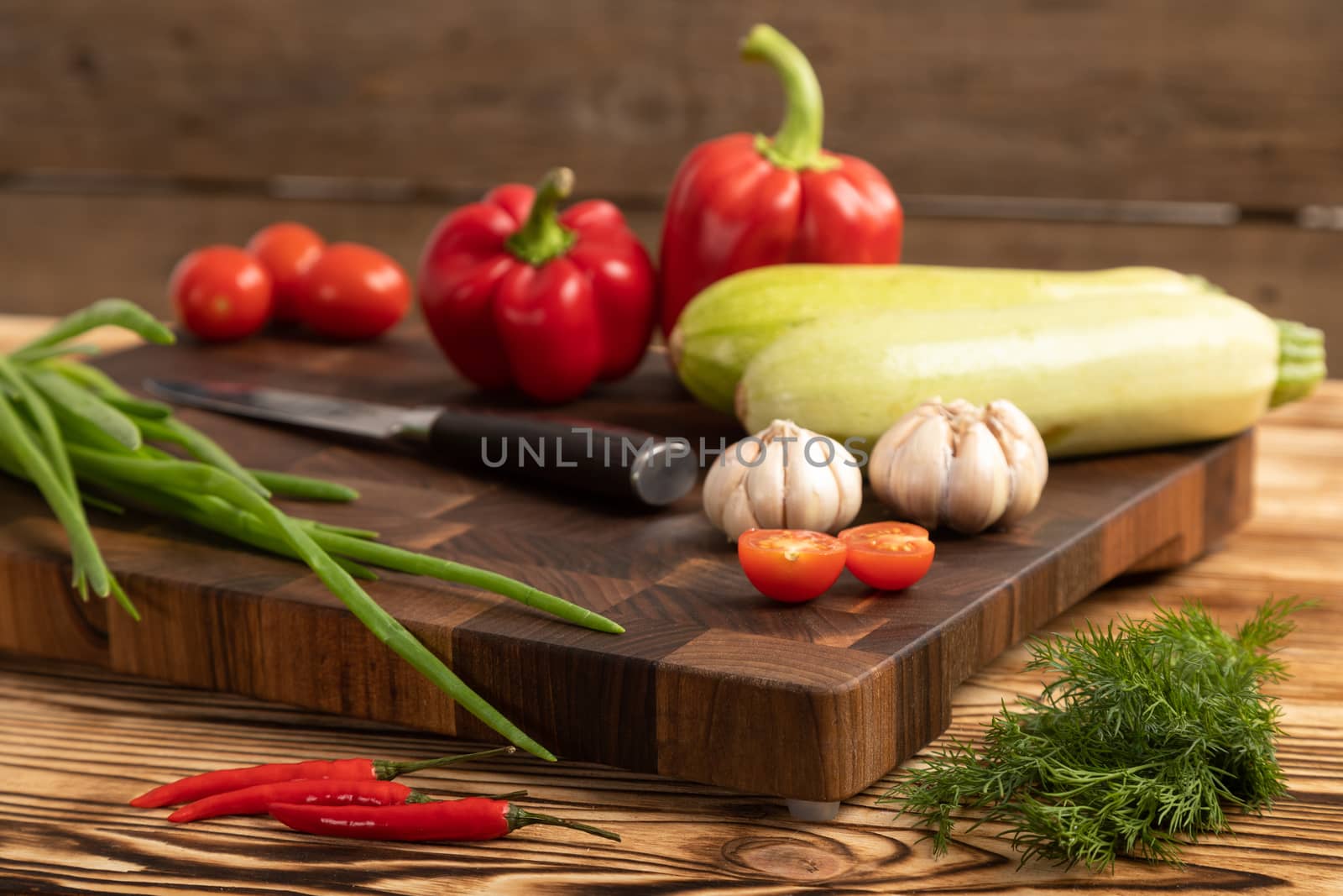 vegetables and greens on wooden cutting board by sveter