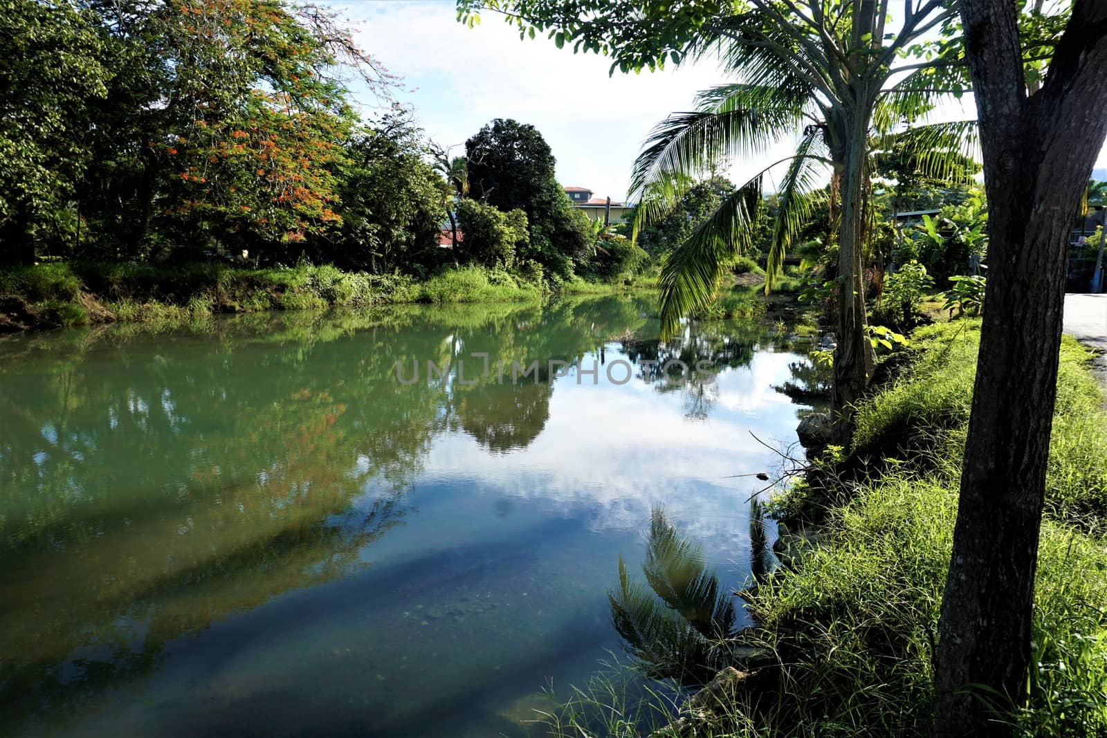 Calm Quebrada Bonita river panorama in the city of Jaco, Costa Rica