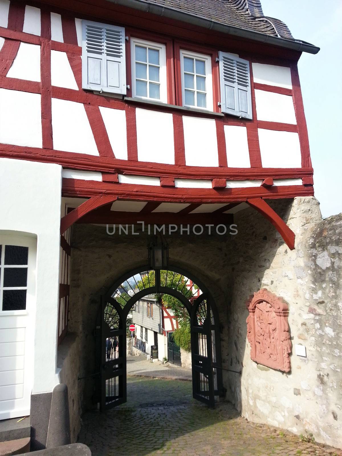 Half timbered house in Limburg, Germany with road and gate