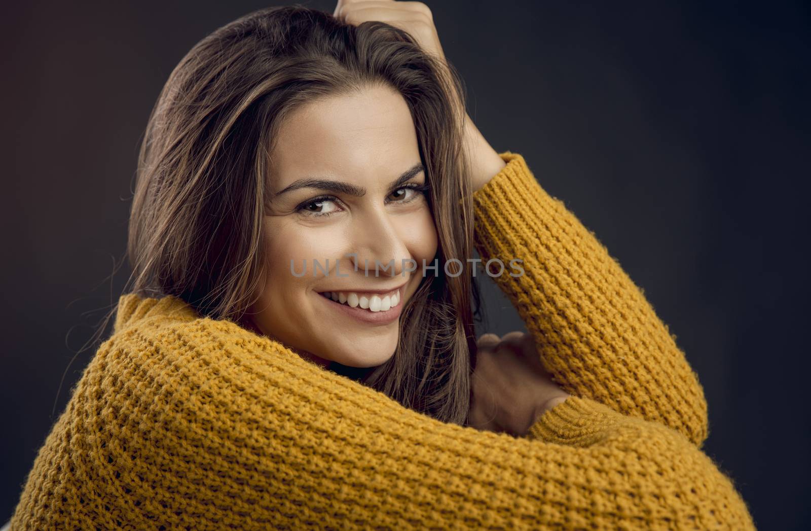 Shot of a beautiful young woman looking to the camera and smiling