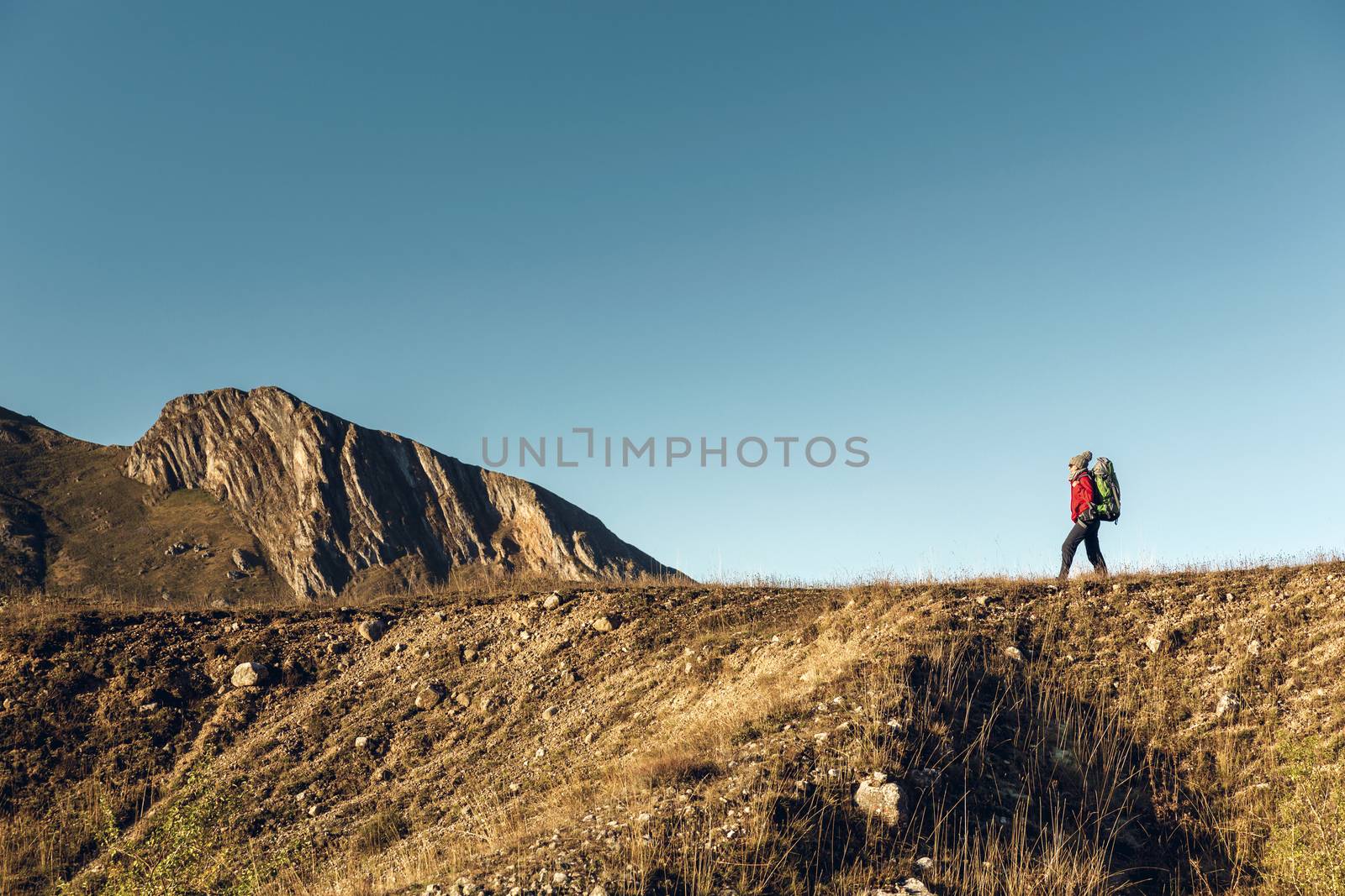 Woman exploring the montains by Iko