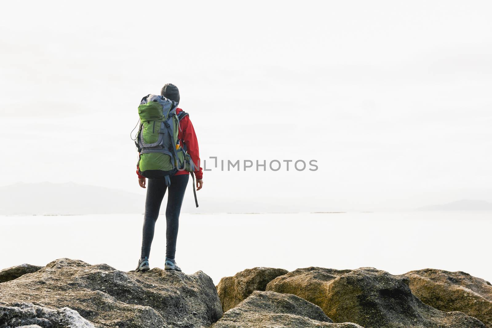 Woman exploring the coast by Iko