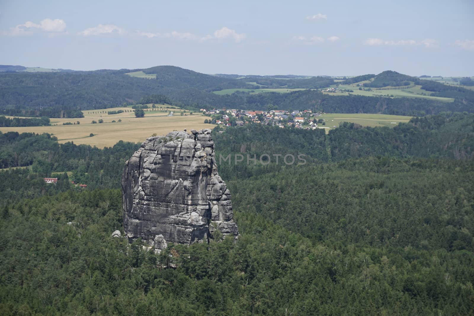 View to the Falkenstein mountain and over green hills in Saxon Switzerland, Germany