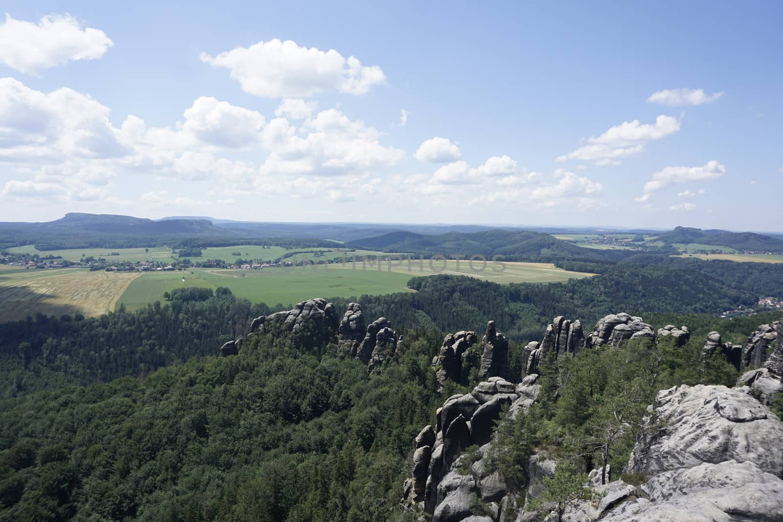 View over the Schrammsteine rocks and hilly landscape in Saxon Switzerland, Germany