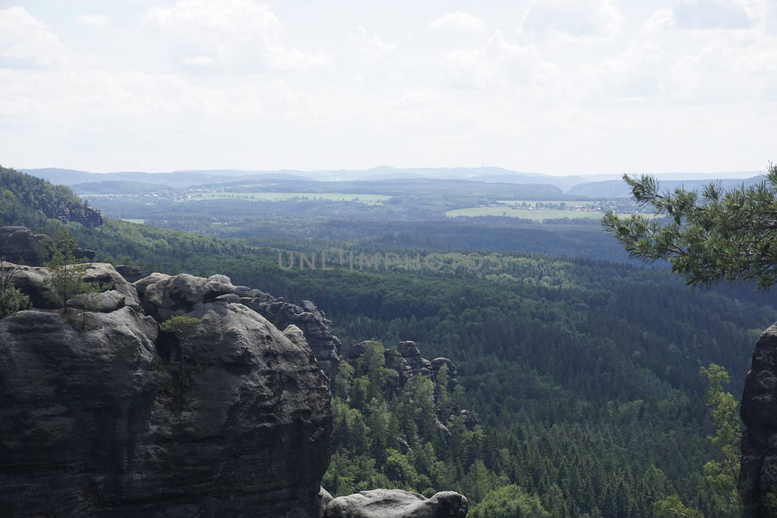 View over wide landscape in Saxon Switzerland with typical rock formations of sandstone