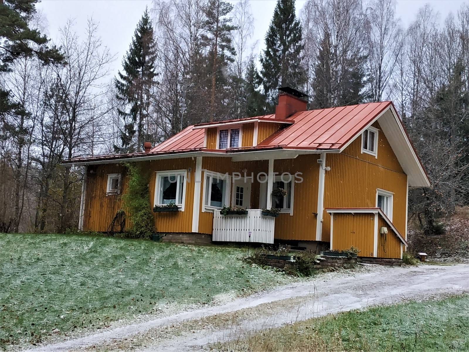 Traditional yellow wooden house in the Nuuksio National Park, Finland