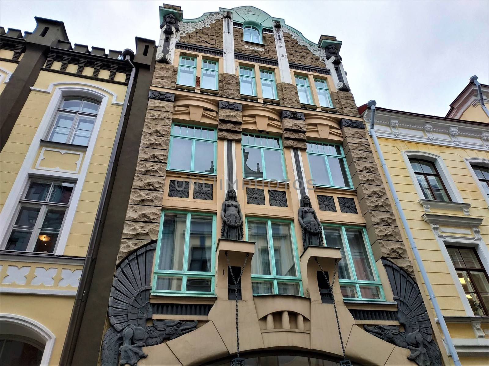 House decorated with dragons and egyptian looking ladies in Tallinn, Estonia