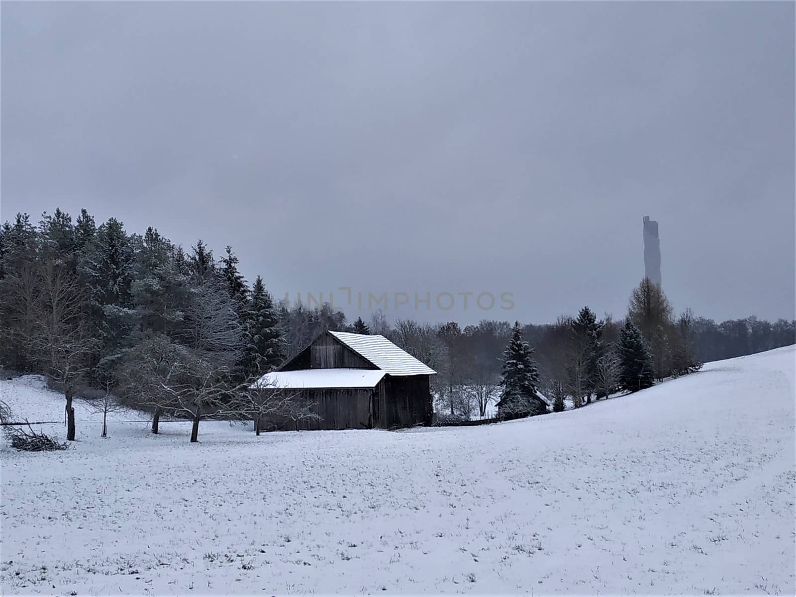 Winter landscape in Rottweil, Germany with wooden hut and test tower