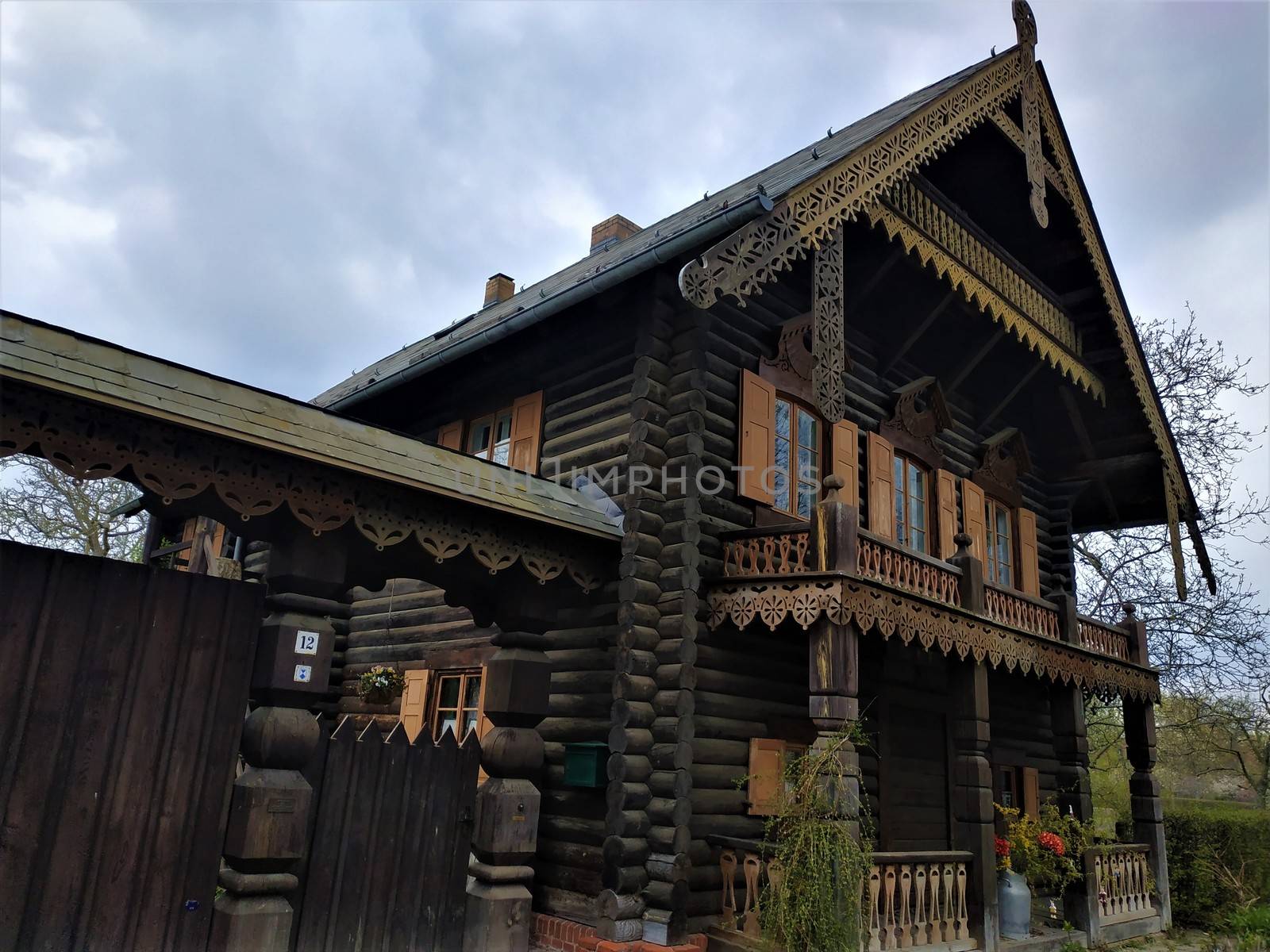 Typical log house in the Russian settlement Alexandrovka by pisces2386