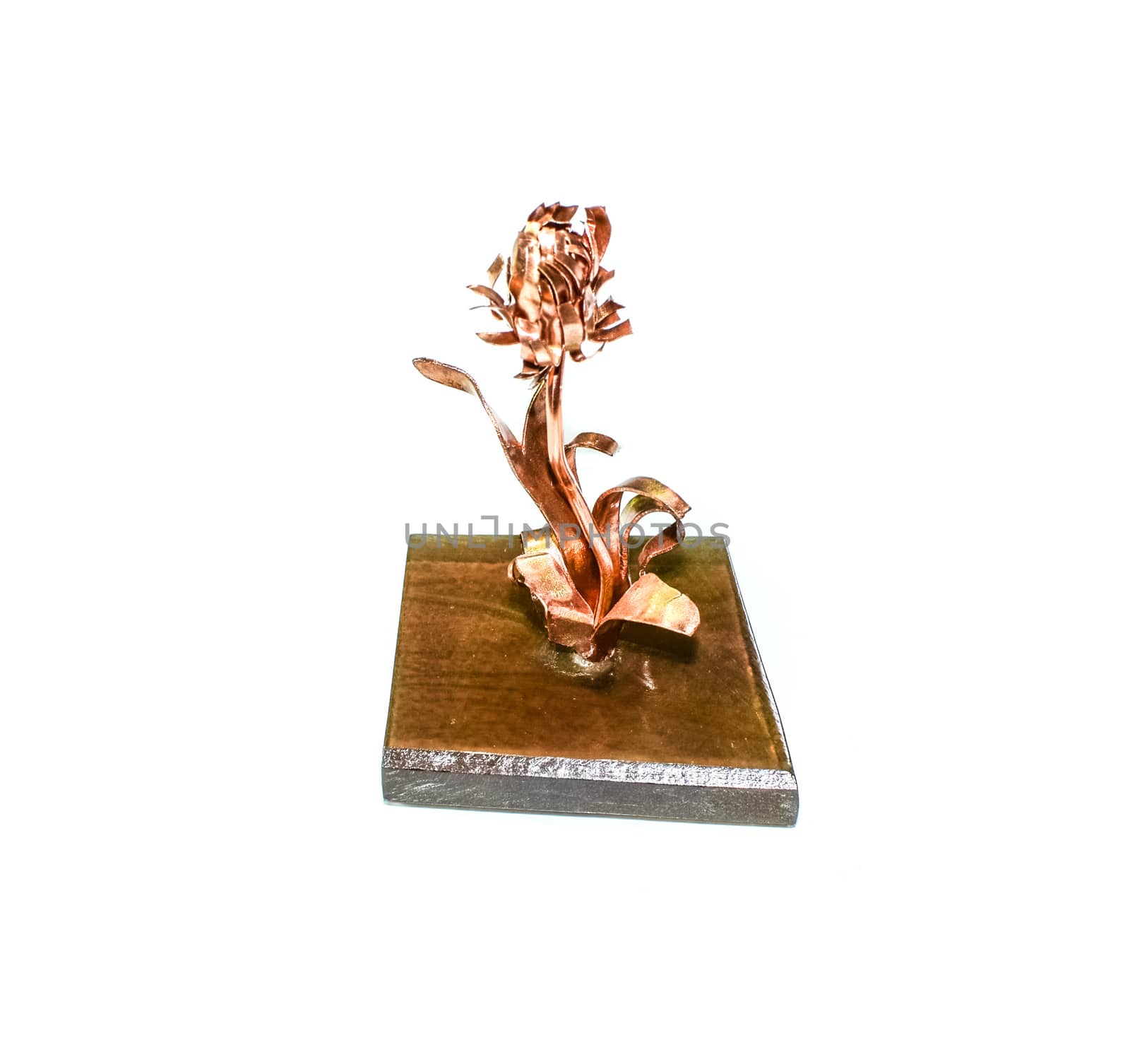 A copper-forged rose on a stand. A beautiful copper product.