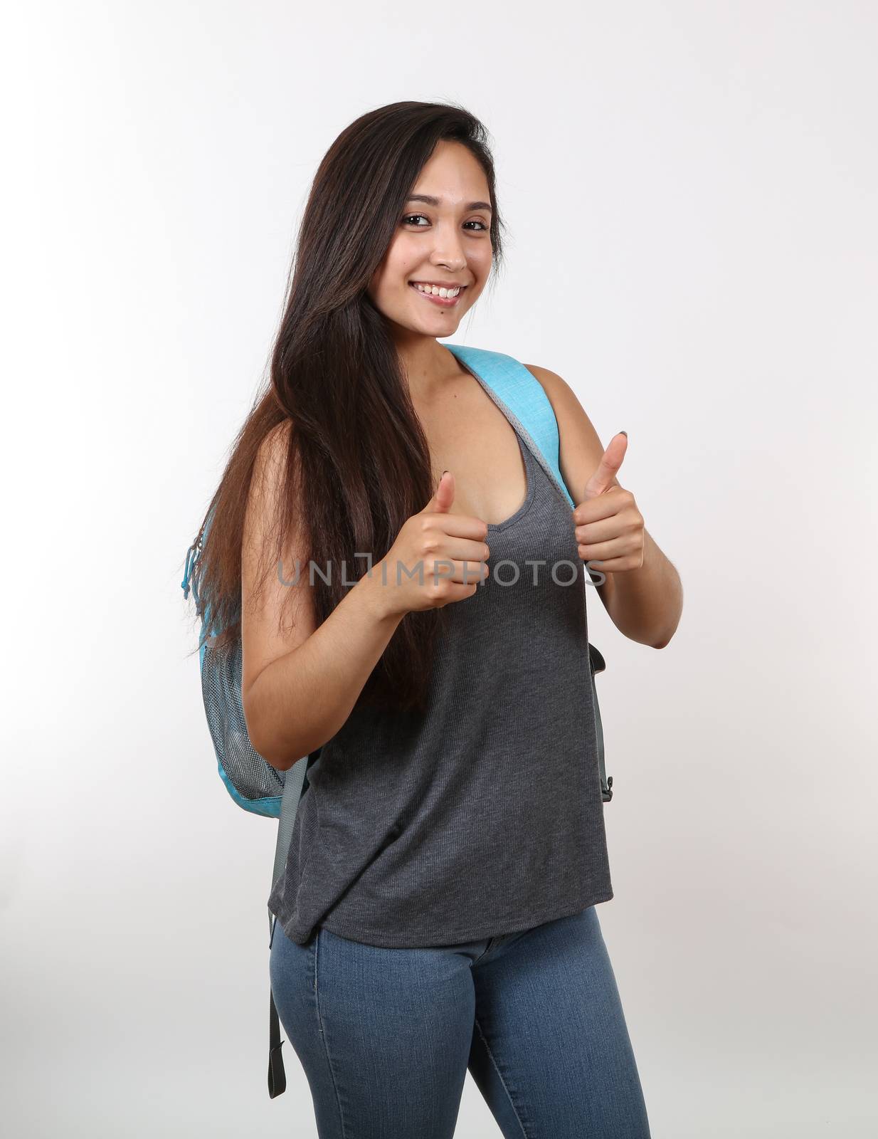 An attractive college student gives you the thumbs up.