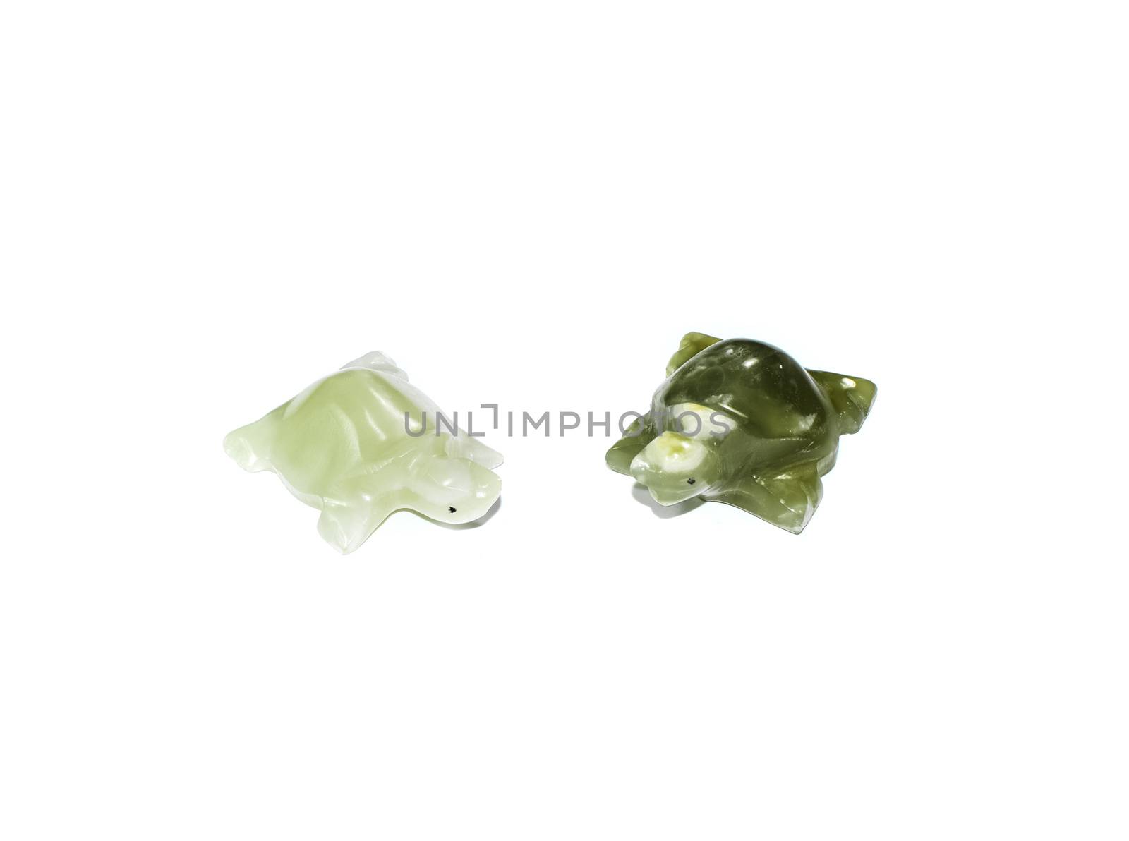 Turtles from green onyx. Stone carving.