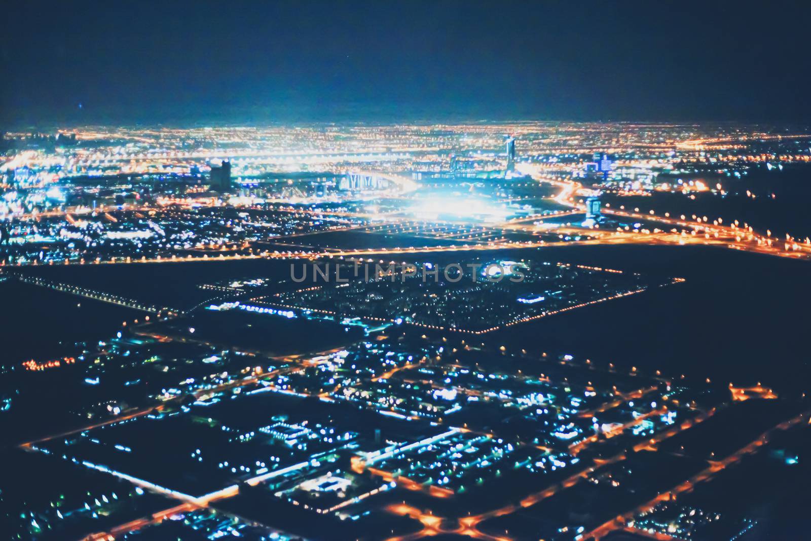 Aerial night view of Dubai in United Arab Emirates, metropolitan cityscape scenery