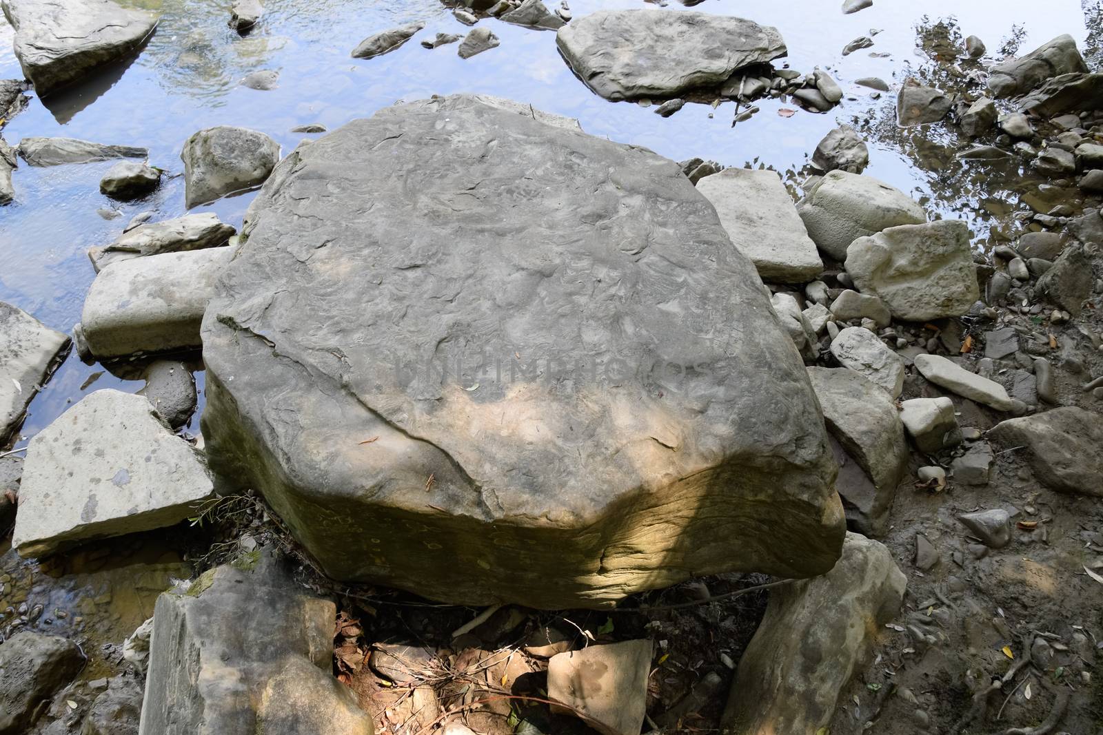 Big stone on the bank of a mountain river. The river in Shapsug.