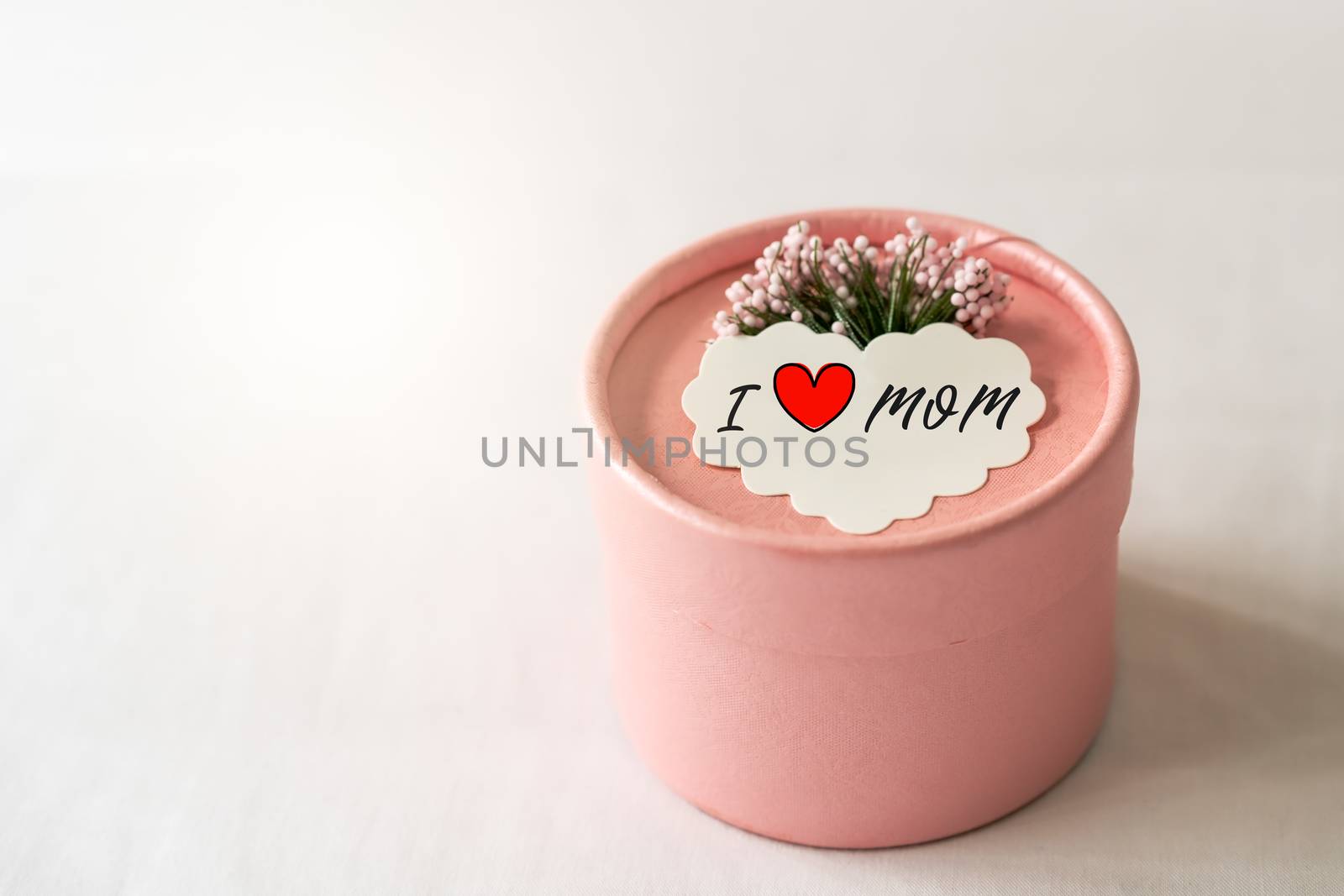 Happy mother's day concept. Gift box and flower, paper tag with  by psodaz