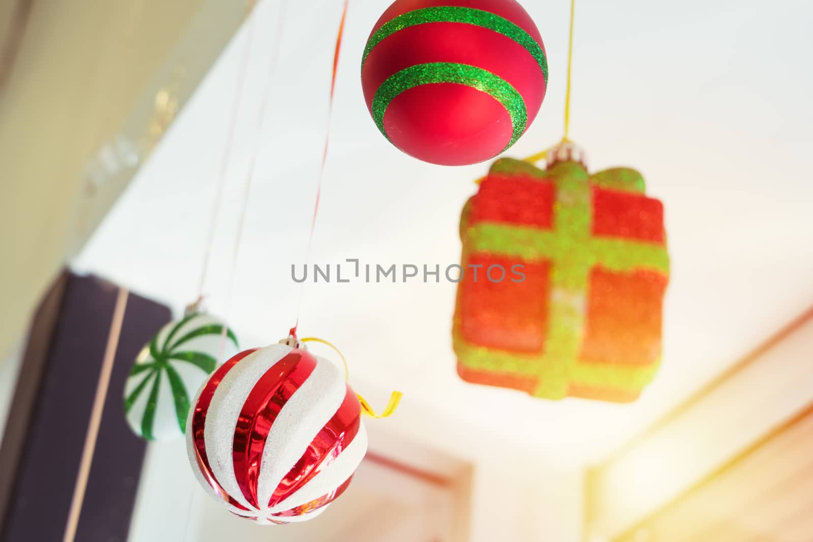 colorful ball and gift box mobile hanging on the ceiling