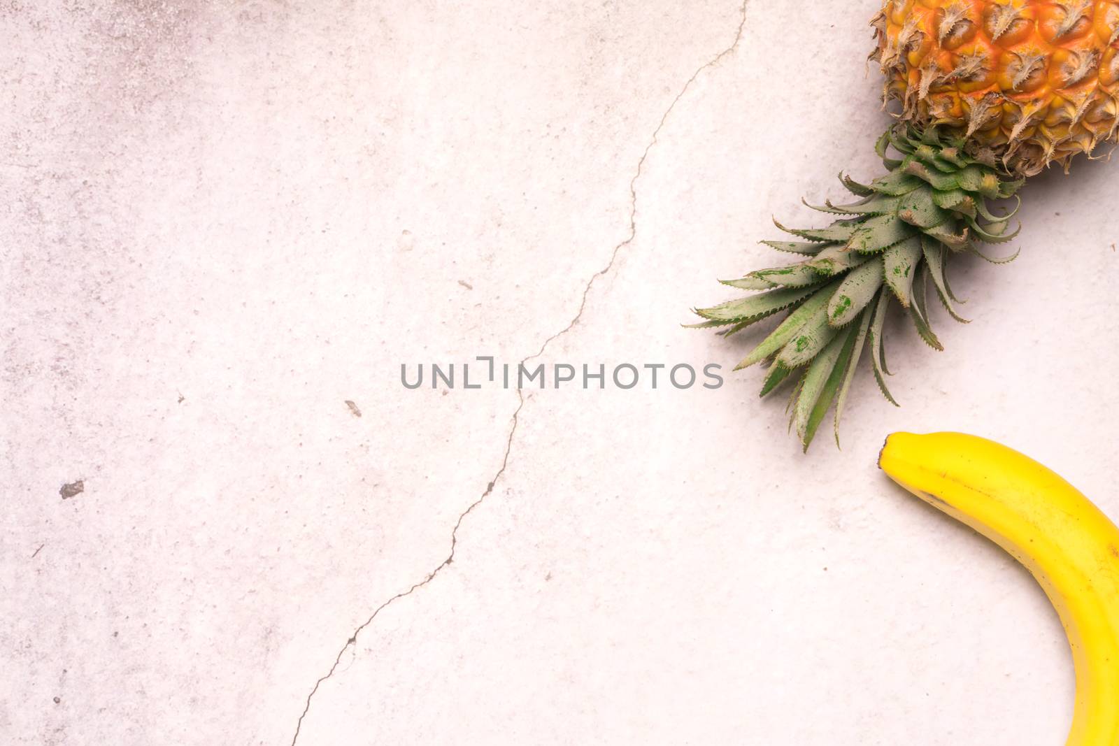 Tropical and Seasonal Summer Fruits. Pineapple and Bananas Arranged in corner of backgrounds, Healthy Lifestyle. Flat Lay